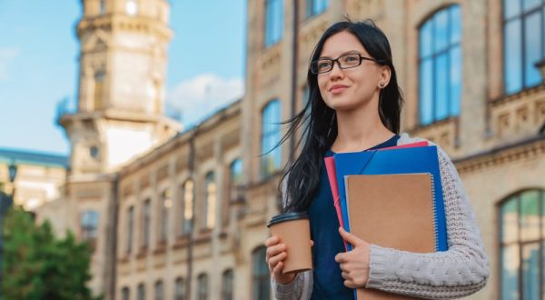 CampusLife_Student_Smiling_Outdoor_GettyImages-1209049220